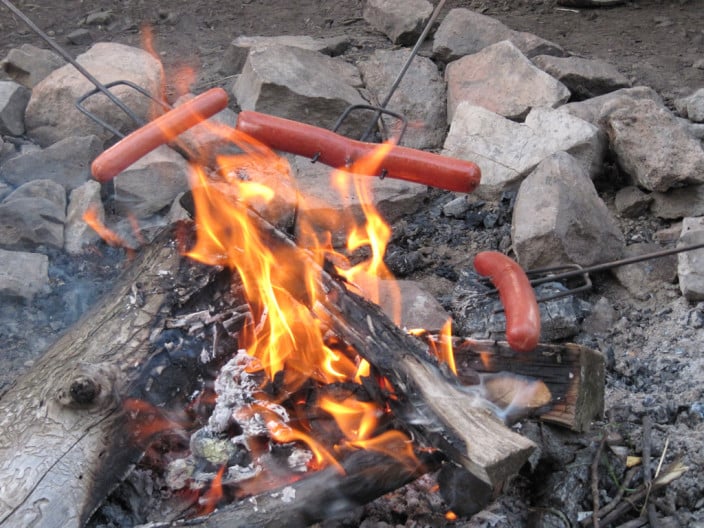 Hotdogs over a flame