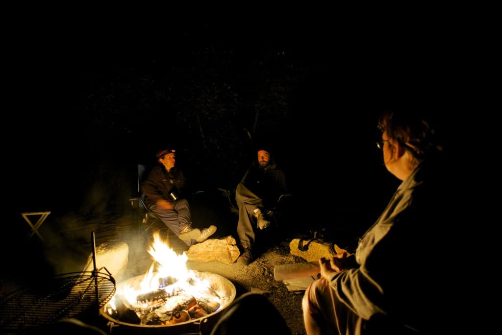 cooking on a campfire in the dark