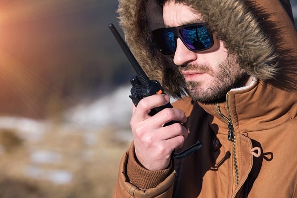 hiker using walkie talkie