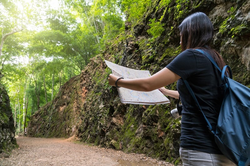 young traveller using a map