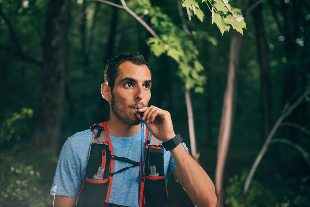 hydration pack being used in the woods