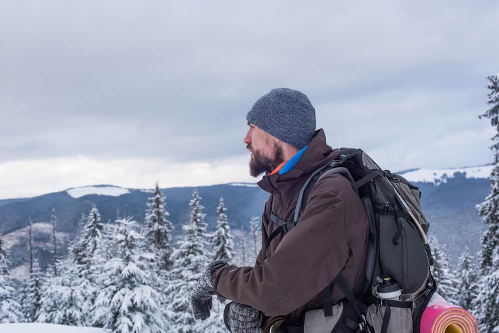 man dressed for cold weather hiking